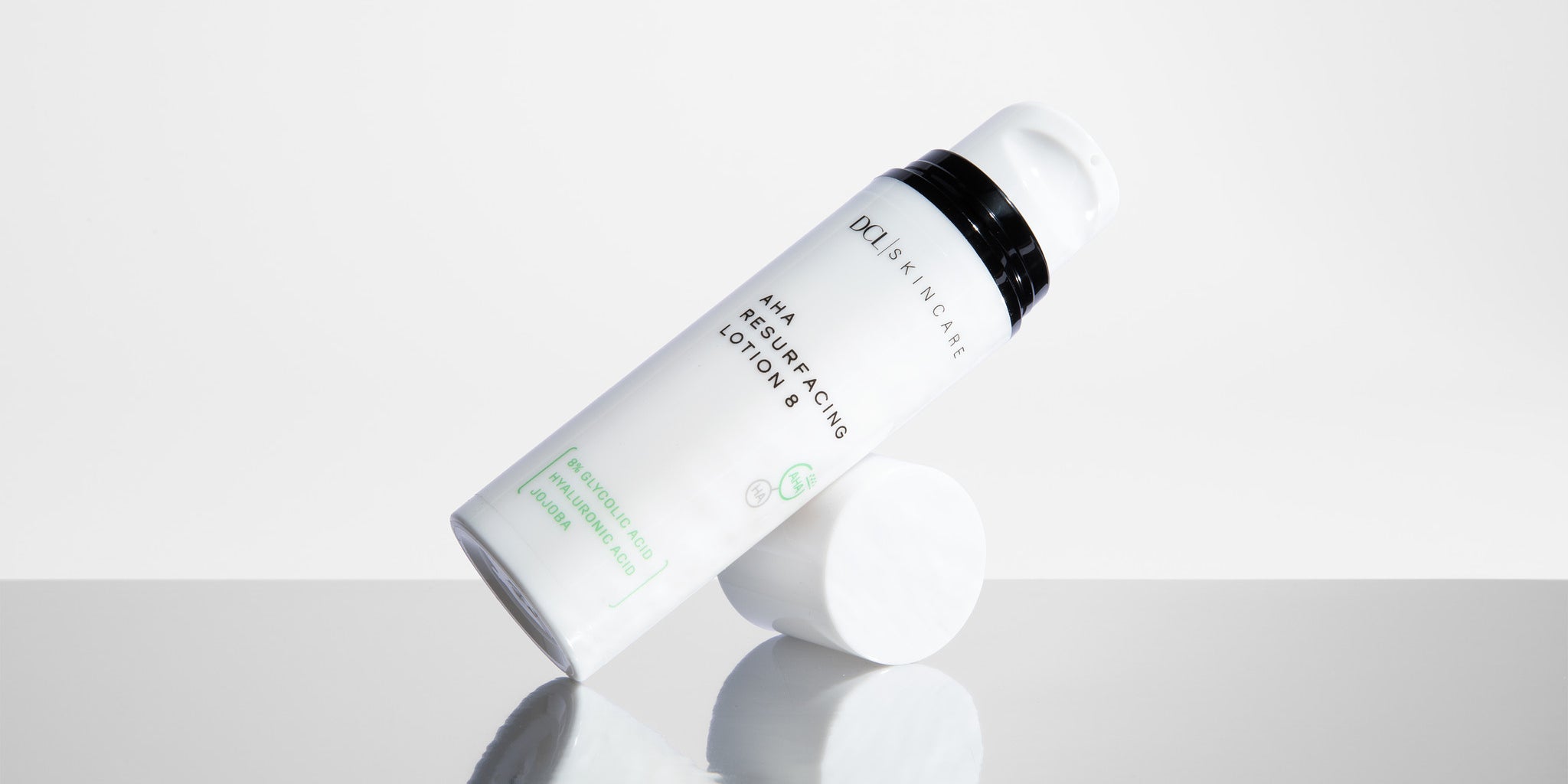 AHA Resurfacing lotion tilted with reflection