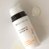 Viatmin C Serum flat lay with serum spots