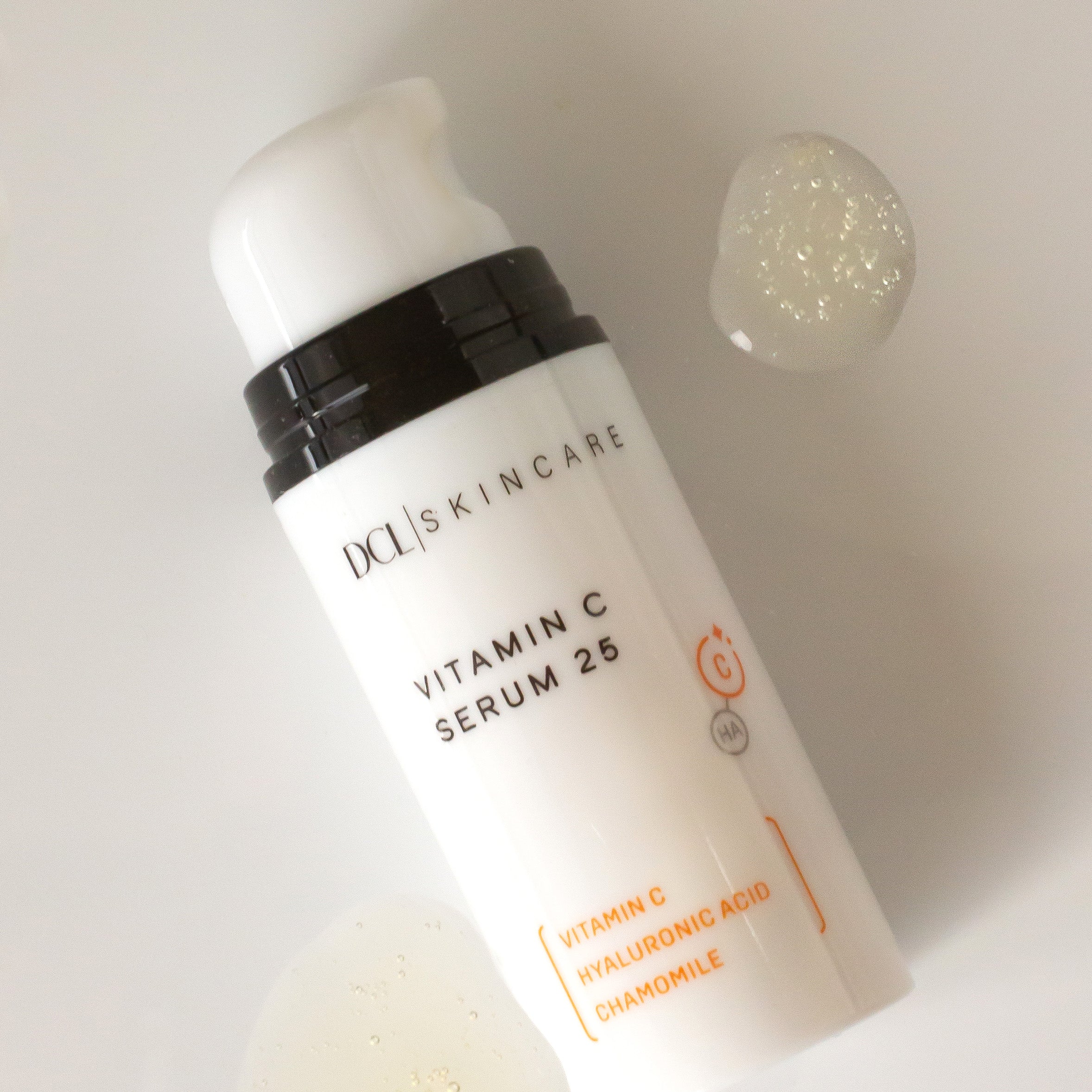 Viatmin C Serum flat lay with serum spots