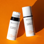 Vitamin C Serum flat lay Duo Cap and no cap on orange background