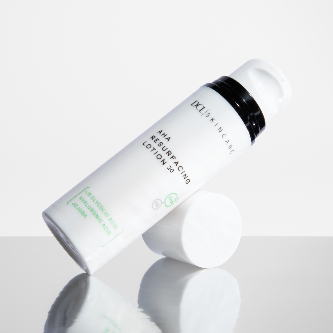 AHA 20 Resurfacing Lotion leaning on cap