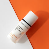 Vitamin C Night Booster 30 flat lay against white and orange background