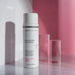 Balancing Cleanser Bottle against Pink Background